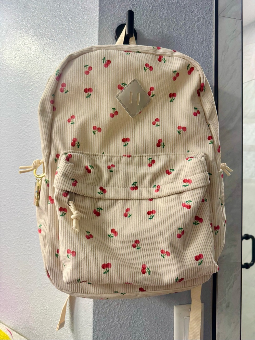 Cream Cherry-Print Backpack. Never used! Bought two by accident.